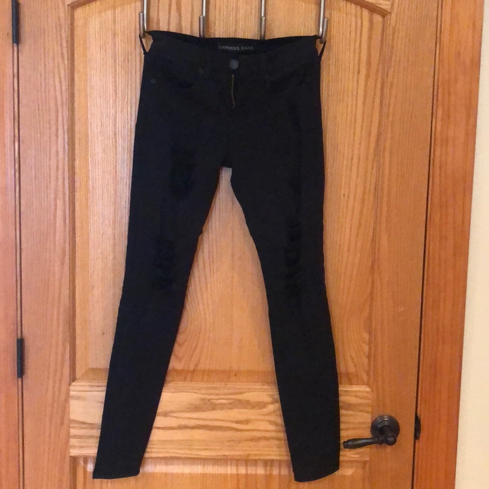 Destructed black Express skinny jeans